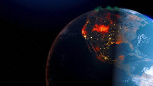 A view of Earth from space showing North America at night, with bright city lights and large red and orange areas indicating fires or heat, and a faint green aurora above the Arctic.