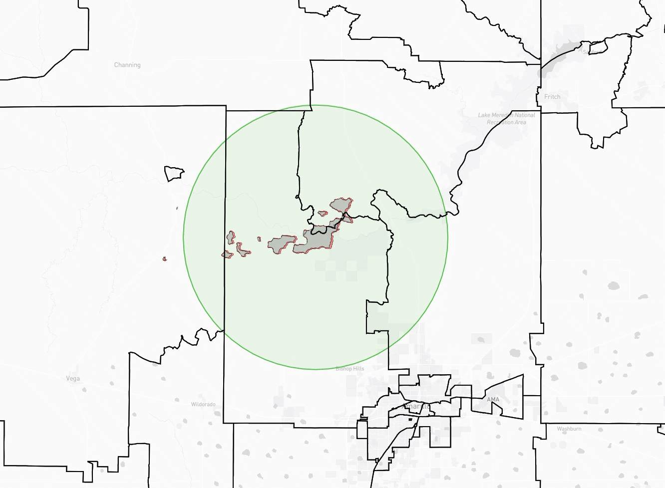 A map shows outlined county borders with a central shaded green circle and a cluster of irregular brown shapes within it, indicating an area of interest. Nearby cities include Vega and Amarillo.