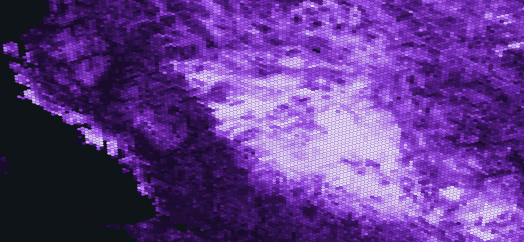 A pixelated, abstract image in shades of purple, with a bright white area in the center and darker purple and black regions surrounding it, resembling a heatmap or digital mosaic pattern.