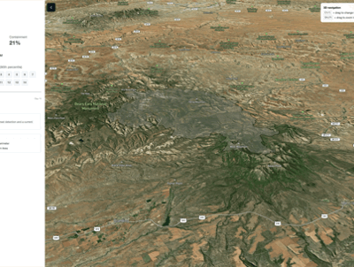 Aerial satellite map view of Babylon, Iraq, showing green and brown terrain impacted by recent wildfire activity, along with visible roads and elevation. A sidebar on the left displays population data and legend, while map controls appear on the right.